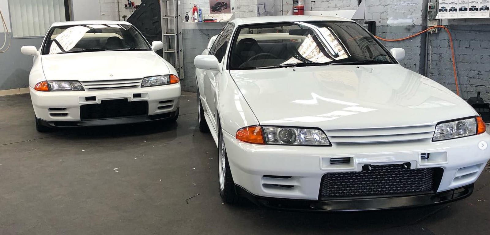 Two Nissan Skyline GT-Rs in the bay