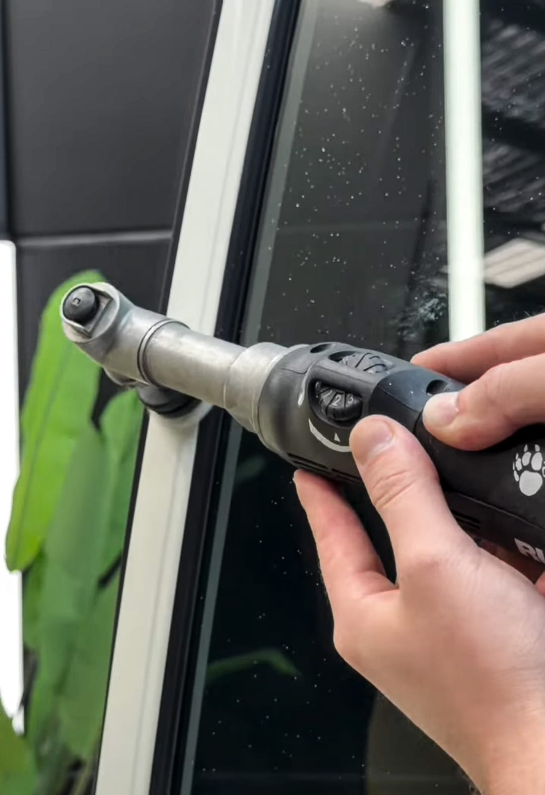 Window tint film being applied